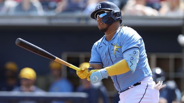 Mar 7, 2024; Port Charlotte, Florida, USA;  Tampa Bay Rays designated hitter Isaac Paredes (17) hits a double against the Philadelphia Phillies in the first inning at Charlotte Sports Park