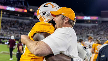 Sep 27, 2025; Starkville, Mississippi, USA; Tennessee Volunteers head coach Josh Heupel and defensive lineman Caleb Herring (31) celebrate after winning the game against the Mississippi State Bulldogs at Davis Wade Stadium at Scott Field. Mandatory Credit: Wesley Hale-Imagn Images