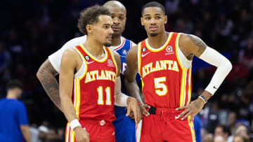 Nov 28, 2022; Philadelphia, Pennsylvania, USA; Philadelphia 76ers forward P.J. Tucker (17) attempts to listen in as Atlanta Hawks guard Trae Young (11) and guard Dejounte Murray (5) talk during a break in the second quarter at Wells Fargo Center. Mandatory Credit: Bill Streicher-USA TODAY Sports