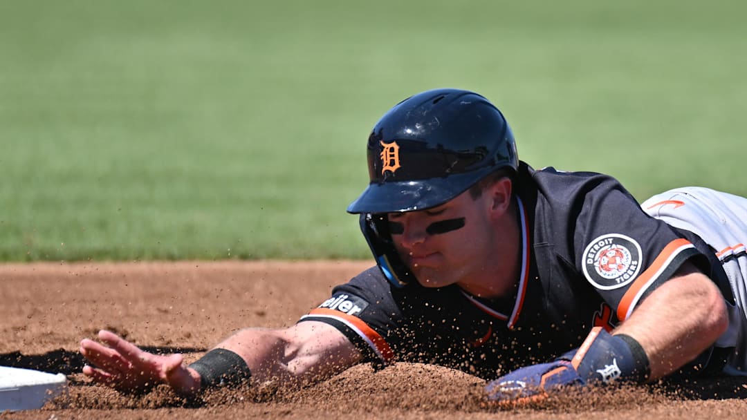 Feb 24, 2026; North Port, Florida, USA; Detroit Tigers shortstop Kevin McGonigle (85) dives back to first base in the first inning against the Atlanta Braves during spring training at CoolToday Park. Mandatory Credit: Jonathan Dyer-Imagn Images