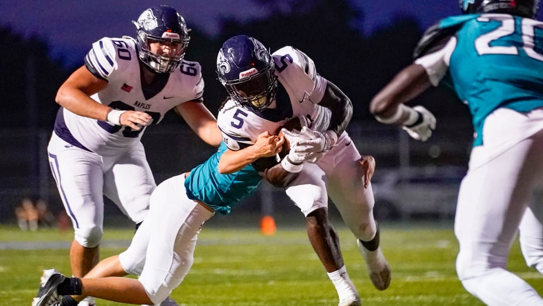 The Naples Golden Eagles compete against the Gulf Coast Sharks in the kickoff classic preseason game at Gulf Coast High School in Naples on Friday, Aug. 16, 2024. Naples won 45-0.