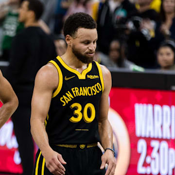 Boston Celtics guard Derrick White (9) and Golden State Warriors guard Stephen Curry (30) on the court during the overtime period at Chase Center. Mandatory Credit: John Hefti-Imagn Images