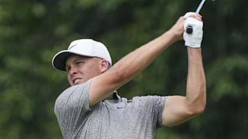 Aug 10, 2024; Greensboro, North Carolina, USA; Nick Hardy hits his approach shot on 18 during the second round of the Wyndham Championship golf tournament at Sedgefield Country Club. Mandatory Credit: Jim Dedmon-Imagn Images