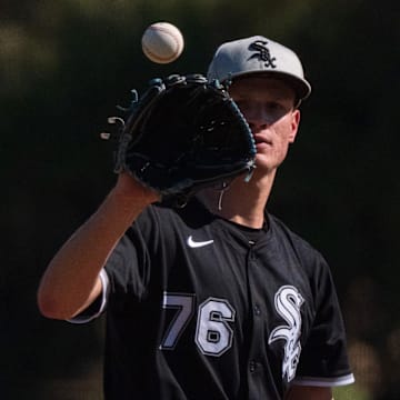 Chicago White Sox pitcher Noah Schultz (76) throws in a spring training game against the San Diego Padres at Camelback Ranch. 