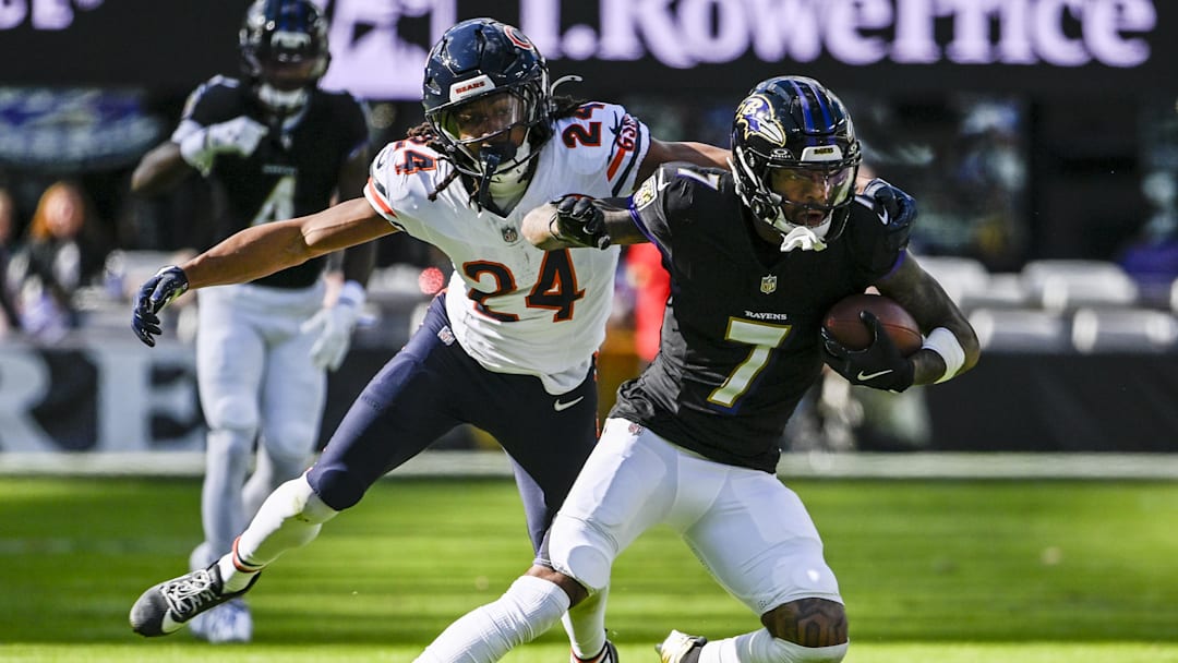 Oct 26, 2025; Baltimore, Maryland, USA;  Baltimore Ravens wide receiver Rashod Bateman (7) rubs after the catch as Chicago Bears cornerback Nick McCloud (24) defends  during the game at M&T Bank Stadium. Mandatory Credit: Tommy Gilligan-Imagn Images