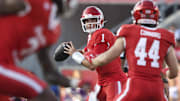 Nov 22, 2025; Houston, Texas, USA; Houston Cougars quarterback Conner Weigman (1) looks for an open receiver during the second quarter against the TCU Horned Frogs at TDECU Stadium. Mandatory Credit: Troy Taormina-Imagn Images