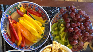 Yes, charcuterie traditionally features meats and cheeses. But use a big table and add some fruits and veggies for color (and nutrition).