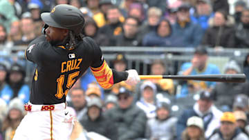 Apr 6, 2025; Pittsburgh, Pennsylvania, USA;  Pittsburgh Pirates center fielder Oneil Cruz (15) hits a single against the New York Yankees during the third inning at PNC Park. Mandatory Credit: Charles LeClaire-Imagn Images