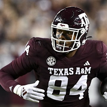 Nov 16, 2024; College Station, Texas, USA; Texas A&M Aggies tight end Tre Watson (84) runs the ball during the first quarter against the New Mexico State Aggies at Kyle Field. Mandatory Credit: Maria Lysaker-Imagn Images 
