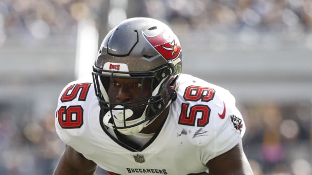 Current Colts player Genard Avery plays for the Buccaneers in 2022, wearing a gray helmet with red pirate flag.