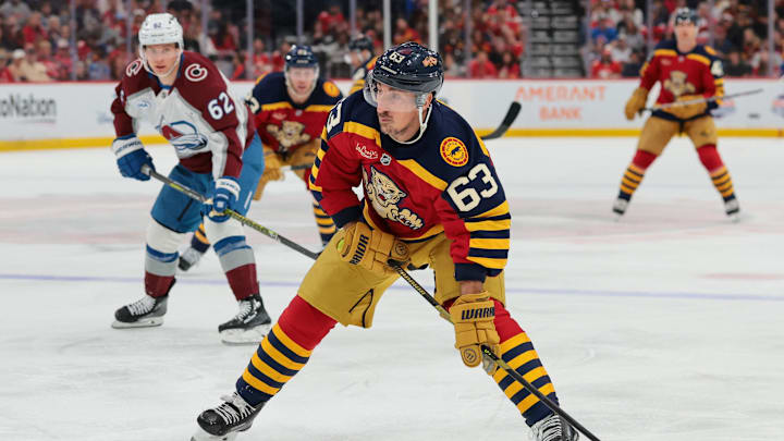 Jan 4, 2026; Sunrise, Florida, USA; Florida Panthers left wing Brad Marchand (63) moves the puck against the Colorado Avalanche during the first period at Amerant Bank Arena. Mandatory Credit: Sam Navarro-Imagn Images