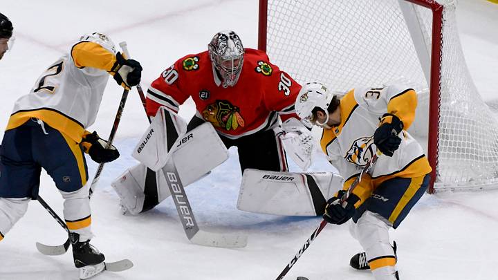 Dec 18, 2018; Chicago, IL, USA; Chicago Blackhawks goaltender Cam Ward (30) defends against Nashville Predators left wing Kevin Fiala (22) and Nashville Predators right wing Ryan Hartman (38) during the third period at the United Center. Mandatory Credit: Matt Marton-USA TODAY Sports Dec 18, 2018; Chicago, IL, USA; Chicago Blackhawks goaltender Cam Ward (30) defends against Nashville Predators left wing Kevin Fiala (22) and Nashville Predators right wing Ryan Hartman (38) during the third period at the United Center. Mandatory Credit: Matt Marton-USA TODAY Sports