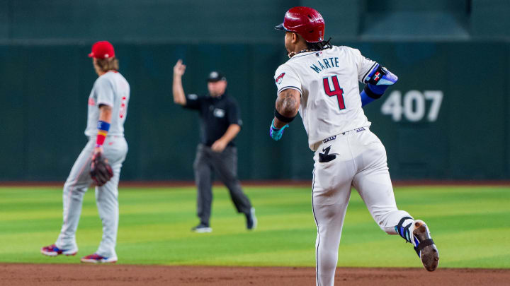 Aug 10, 2024; Phoenix, Arizona, USA; Arizona Diamondbacks infielder Ketel Marte (4) reacts after hitting a home run in the first inning against the Philadelphia Phillies at Chase Field. Mandatory Credit: Allan Henry-USA TODAY Sports