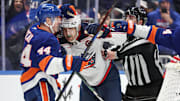 Jan 20, 2025; Elmont, New York, USA;  New York Islanders center Jean-Gabriel Pageau (44) and Columbus Blue Jackets left wing James van Riemsdyk (21) fight in the third period at UBS Arena. Mandatory Credit: Wendell Cruz-Imagn Images