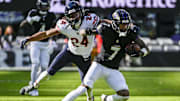 Oct 26, 2025; Baltimore, Maryland, USA;  Baltimore Ravens wide receiver Rashod Bateman (7) runs after the catch as Chicago Bears cornerback Nick McCloud (24) defends  during the game at M&T Bank Stadium. Mandatory Credit: Tommy Gilligan-Imagn Images