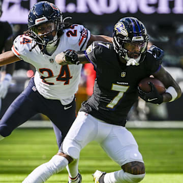 Oct 26, 2025; Baltimore, Maryland, USA;  Baltimore Ravens wide receiver Rashod Bateman (7) runs after the catch as Chicago Bears cornerback Nick McCloud (24) defends  during the game at M&T Bank Stadium. Mandatory Credit: Tommy Gilligan-Imagn Images
