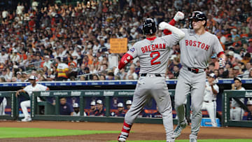 Boston Red Sox players Roman Anthony and Alex Bregman celebrate against the Houston Astros.