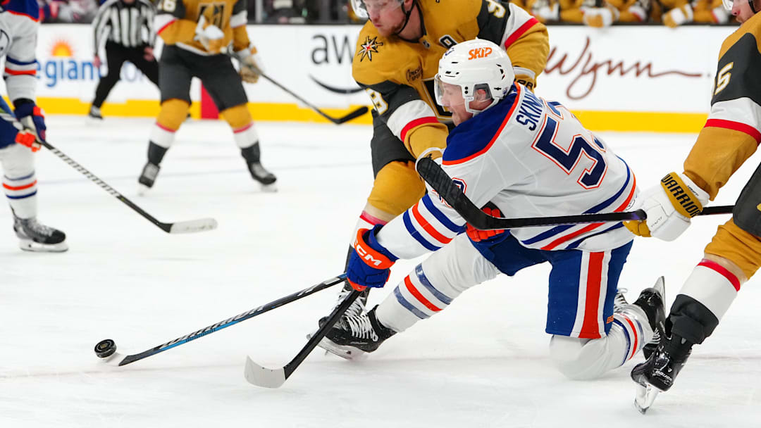 Dec 3, 2024; Las Vegas, Nevada, USA; Vegas Golden Knights center Jack Eichel (9) checks Edmonton Oilers center Jeff Skinner (53) during the third period at T-Mobile Arena. Mandatory Credit: Stephen R. Sylvanie-Imagn Images