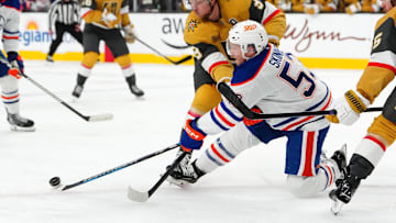 Dec 3, 2024; Las Vegas, Nevada, USA; Vegas Golden Knights center Jack Eichel (9) checks Edmonton Oilers center Jeff Skinner (53) during the third period at T-Mobile Arena. Mandatory Credit: Stephen R. Sylvanie-Imagn Images