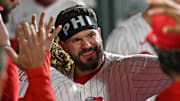 Sep 9, 2025; Philadelphia, Pennsylvania, USA; Philadelphia Phillies outfielder Kyle Schwarber (12) celebrates in the dugout after hitting his 50th home run of the season during the seventh inning against the New York Mets at Citizens Bank Park. Mandatory Credit: Eric Hartline-Imagn Images