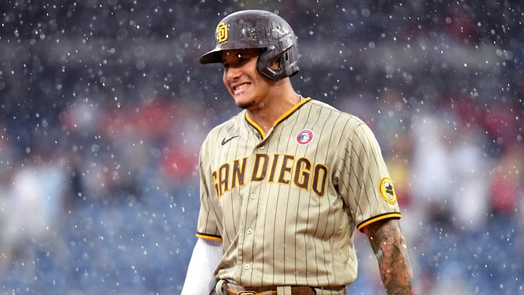 Jul 4, 2021; Philadelphia, Pennsylvania, USA; San Diego Padres third baseman Manny Machado (13) during the rain in the ninth inning against the Philadelphia Phillies at Citizens Bank Park. Mandatory Credit: Eric Hartline-Imagn Images