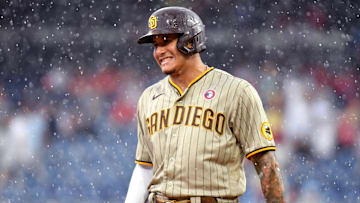 Jul 4, 2021; Philadelphia, Pennsylvania, USA; San Diego Padres third baseman Manny Machado (13) during the rain in the ninth inning against the Philadelphia Phillies at Citizens Bank Park. Mandatory Credit: Eric Hartline-Imagn Images