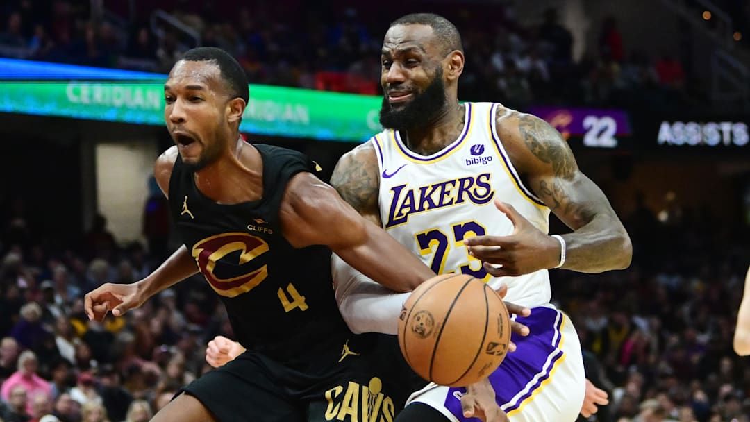 Nov 25, 2023; Cleveland, Ohio, USA; Cleveland Cavaliers forward Evan Mobley (4) fouls Los Angeles Lakers forward LeBron James (23) during the second half at Rocket Mortgage FieldHouse. Mandatory Credit: Ken Blaze-Imagn Images