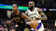Nov 25, 2023; Cleveland, Ohio, USA; Cleveland Cavaliers forward Evan Mobley (4) fouls Los Angeles Lakers forward LeBron James (23) during the second half at Rocket Mortgage FieldHouse. Mandatory Credit: Ken Blaze-Imagn Images