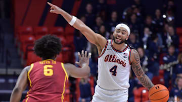 Jan 11, 2025; Champaign, Illinois, USA;  Illinois Fighting Illini guard Kylan Boswell (4) directs the offense as USC Trojans guard Wesley Yates III (6) guards him during the first half at State Farm Center. Mandatory Credit: Ron Johnson-Imagn Images