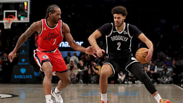 Mar 28, 2025; Brooklyn, New York, USA; Brooklyn Nets forward Cameron Johnson (2) controls the ball against Los Angeles Clippers forward Kawhi Leonard (2) during the third quarter at Barclays Center. Mandatory Credit: Brad Penner-Imagn Images