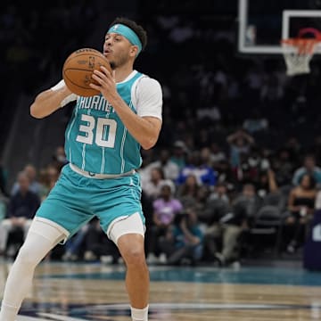 Apr 4, 2025; Charlotte, North Carolina, USA; Charlotte Hornets guard Seth Curry (30) pulls up to shoot a three against the Sacramento Kings during the second half at Spectrum Center. Mandatory Credit: Jim Dedmon-Imagn Images