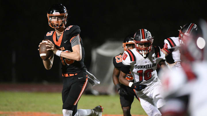 Cocoa QB Brady Hart rolls away from the Dunnellon defense to pass during their game in the FHSAA football playoffs Friday, November 17, 2023. Craig Bailey/FLORIDA TODAY via USA TODAY NETWORK