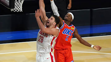Dec 14, 2024; Las Vegas, Nevada, USA; Houston Rockets center Alperen Sengun (28) shoots against Oklahoma City Thunder guard Shai Gilgeous-Alexander (2) during the third quarter in a semifinal of the 2024 Emirates NBA Cup at T-Mobile Arena. Mandatory Credit: Kyle Terada-Imagn Images