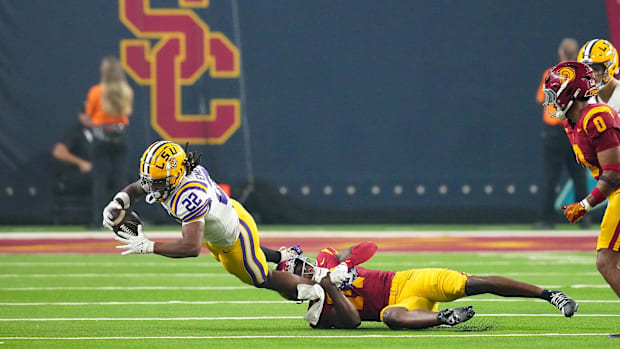 Sep 1, 2024; Paradise, Nevada, USA; Southern California Trojans linebacker Mason Cobb (13) tackles LSU Tigers running back Jo