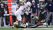 Sep 20, 2025; Atlanta, Georgia, USA; Temple Owls tight end Ryder Kusch (33) is tackled by Georgia Tech Yellow Jackets defensive back Rodney Shelley (6) in the second quarter at Bobby Dodd Stadium at Hyundai Field. Mandatory Credit: Brett Davis-Imagn Images