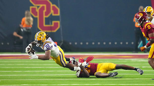 Sep 1, 2024; Paradise, Nevada, USA; Southern California Trojans linebacker Mason Cobb (13) tackles LSU Tigers running back