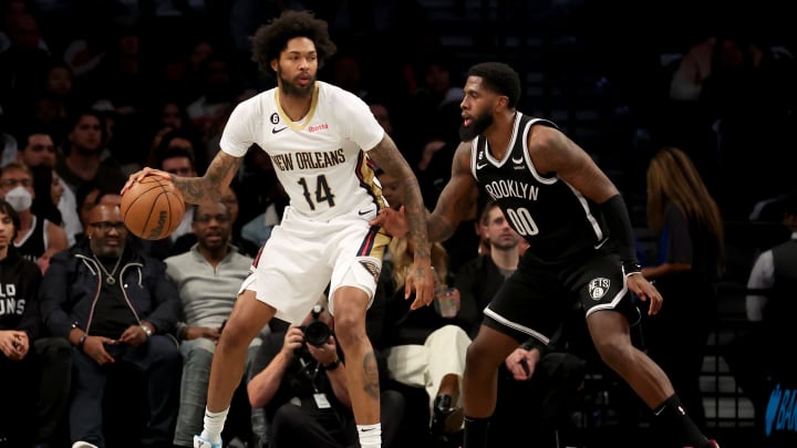 Oct 19, 2022; Brooklyn, New York, USA; New Orleans Pelicans forward Brandon Ingram (14) controls the ball against Brooklyn Nets forward Royce O'Neale (00) during the second quarter at Barclays Center. Mandatory Credit: Brad Penner-USA TODAY Sports