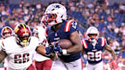 Aug 8, 2025; Foxborough, Massachusetts, USA; New England Patriots running back Terrell Jennings (26) scores a touchdown against the Washington Commanders during the second half at Gillette Stadium. Mandatory Credit: Brian Fluharty-Imagn Images