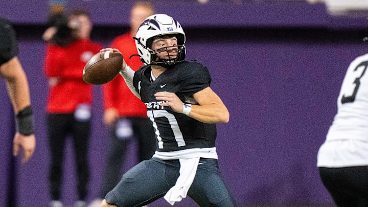 Liberty's Reece Rettig (17) looks to throw during the Class 5A semifinal against Southeast Polk on Friday, Nov. 15, 2024, at the UNI-Dome in Cedar Falls, IA. Liberty's Reece Rettig (17) looks to throw during the Class 5A semifinal against Southeast Polk on Friday, Nov. 15, 2024, at the UNI-Dome in Cedar Falls, IA.