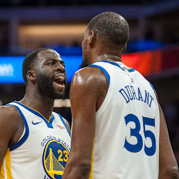 Dec 14, 2018; Sacramento, CA, USA; Golden State Warriors forward Draymond Green (23) and forward Kevin Durant (35) celebrate after defeating the Sacramento Kings at Golden 1 Center. Mandatory Credit: Ed Szczepanski-Imagn Images