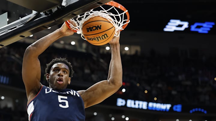Mar 29, 2026; Washington, DC, USA; UConn Huskies forward Tarris Reed Jr. (5) dunks the ball against the Duke Blue Devils in the second half during an Elite Eight game of the East Regional of the men's 2026 NCAA Tournament at Capital One Arena. Mandatory Credit: Amber Searls-Imagn Images