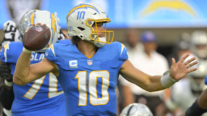 Sep 8, 2024; Inglewood, California, USA; Los Angeles Chargers quarterback Justin Herbert (10) looks to pass in the second half against the Las Vegas Raiders at SoFi Stadium. Mandatory Credit: Jayne Kamin-Oncea-Imagn Images