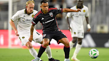D.C. United midfielder Randall Leal (11) and Charleston Battery midfielder Chris Allan (4) go after the ball during the second half of the game at Audi Field. 