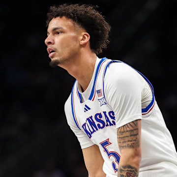 Mar 12, 2025; Kansas City, MO, USA; Kansas Jayhawks guard Zeke Mayo (5) dribbles the ball during the first half against the UCF Knights at T-Mobile Center. 
