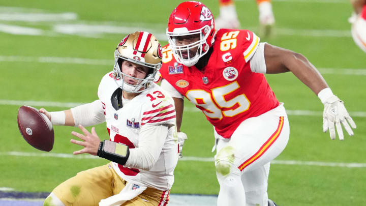 Feb 11, 2024; Paradise, Nevada, USA; San Francisco 49ers quarterback Brock Purdy (13) is pressured by Kansas City Chiefs defensive tackle Chris Jones (95) in the second half in Super Bowl LVIII at Allegiant Stadium. Mandatory Credit: Stephen R. Sylvanie-USA TODAY Sports