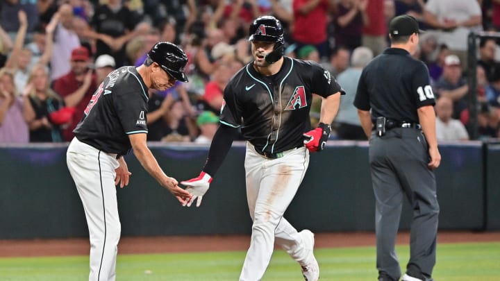 Aug 29, 2024; Phoenix, Arizona, USA;  Arizona Diamondbacks outfielder Randal Grichuk (15) celebrates with third base coach Tony Perezchica (21) after hitting a two run home run in the third inning against the New York Mets at Chase Field. Mandatory Credit: Matt Kartozian-USA TODAY Sports