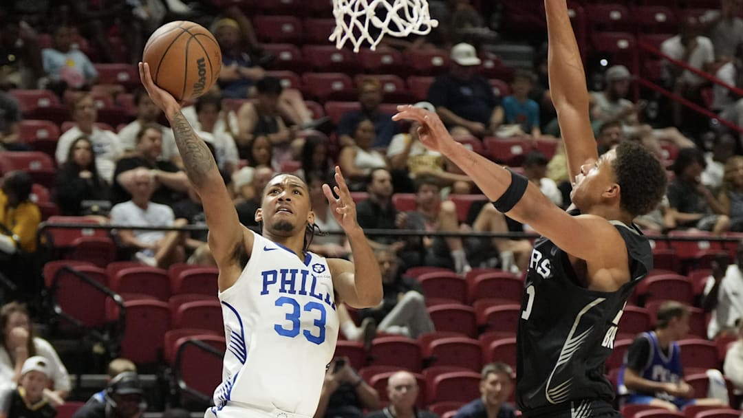 Jul 10, 2025; Las Vegas, NV, USA; Philadelphia 76ers guard Judah Mintz (33) shoots against San Antonio Spurs forward Carter Bryant (11) in the third quarter of their game at Thomas & Mack Center. Mandatory Credit: Candice Ward-Imagn Images