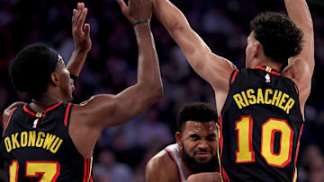 Zaccharie Risacher and Onyeka Okongwu smother Karl Anthony-Towns on a drive to the rim 