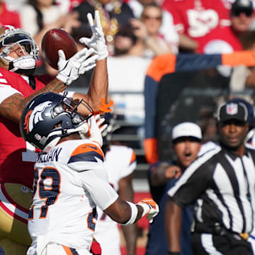 Aug 9, 2025; Santa Clara, California, USA;  San Francisco 49ers wide receiver Jordan Watkins makes a reception over Denver Broncos cornerback Ja'Quan McMillian (29) in the first quarter against the Denver Broncos at Levi's Stadium. Mandatory Credit: David Gonzales-Imagn Images