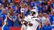 Mississippi State Bulldogs quarterback Kamario Taylor (1) gestures toward the crowd after scoring a touchdown against the Florida Gators during the first half at Ben Hill Griffin Stadium.